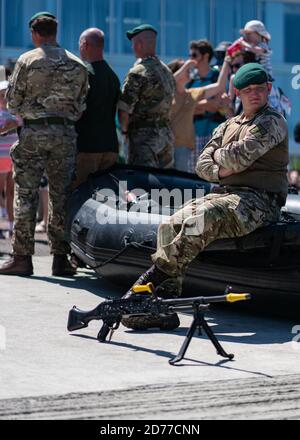 Royal Marine Commando takes time out from their display at the Llandudno Armed Forces Day Stock Photo