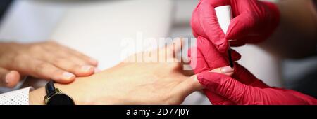 Worker wearing red gloves Stock Photo