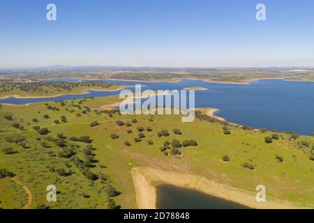 Dam lake reservoir drone aerial view of Barragem do Caia Dam olive trees landscape in Alentejo, Portugal Stock Photo