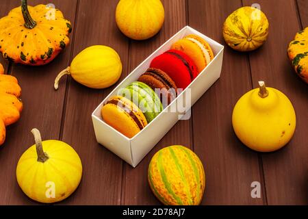 French Macarons In Autumn Colors. Halloween Dessert, Thanksgiving Menu 