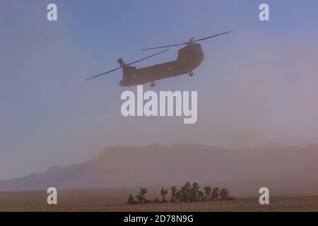 U.S. Army Boeing CH-47 Chinook departs a landing zone after unloading soldiers Paktika Province in Sharana, Afghanistan, 13, November, 2002. Amel Emri Stock Photo