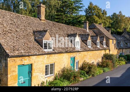 Evening light on traditional stone cottages in the Cotswold village of Snowshill, Gloucestershire UK Stock Photo
