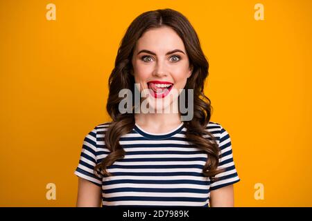 I'm starving Closeup photo of pretty funky wavy lady licking tongue red bright lips perfect toothy smile wear white casual striped t-shirt isolated Stock Photo