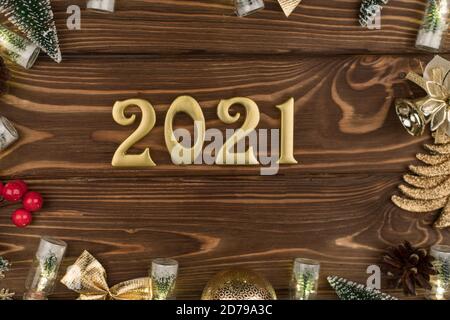 new year 2021 Golden numbers on wooden background with new year decor, Happy Christmas background Stock Photo