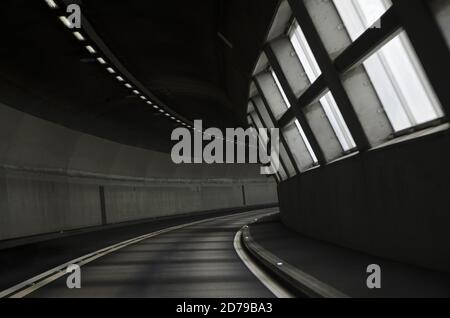 Narrow Tunnel with Light Effect in Switzerland. Stock Photo