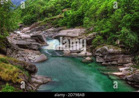 River and Rocks in Long Exposure in Valley Verzasca in Ticino, Switzerland. Stock Photo