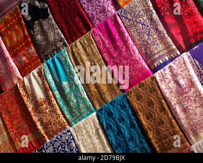 Colourful fabrics for sale in Souk in Dubai Stock Photo