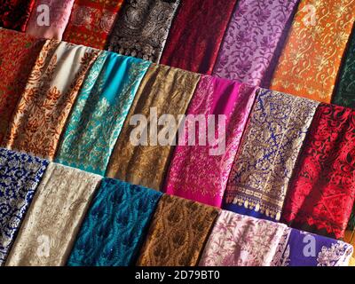 Colourful fabrics for sale in Souk in Dubai Stock Photo
