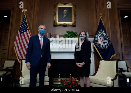 Washington, DC, USA. 21st Oct, 2020. Supreme Court nominee Judge Amy Coney Barrett meets with U.S. Sen. Rob Portman (R-OH) at the U.S. Capitol on October 21, 2020 in Washington, DC. President Donald Trump nominated Barrett to replace Justice Ruth Bader Ginsburg after her death. ( Credit: Stefani Reynolds/Getty Images) Credit: Stefani Reynolds/Pool Via Cnp/Media Punch/Alamy Live News Stock Photo