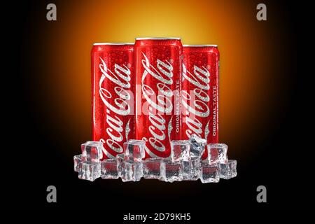 Kuala Lumpur, Malaysia - October 19, 2020 : Coca Cola or Coke Drink on yellow gradient light and black background Stock Photo
