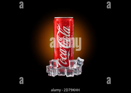 Kuala Lumpur, Malaysia - October 19, 2020 : Coca Cola or Coke Drink on yellow gradient light and black background Stock Photo