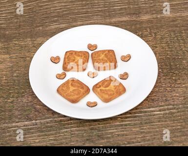 Delicious biscuits in a plate, Love theme concept Stock Photo