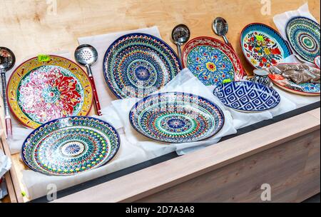 Ethnic Uzbek ceramic round plates with traditional Uzbek ornaments. Decorative ceramic plates with patterns