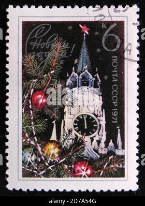 MOSCOW, RUSSIA - APRIL 2, 2017: A post stamp printed in USSR shows Spasski Tower and Fir Branch, Kremlin, New Year 1971, circa 1971 Stock Photo