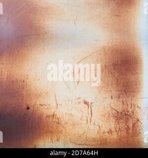 Close view of the surface of a steel door rusted with age in the early morning light. Stock Photo