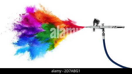 professional chrome metal airbrush acrylic color paint gun tool with colorful rainbow spray holi powder cloud explosion isolated on white panorama bac Stock Photo