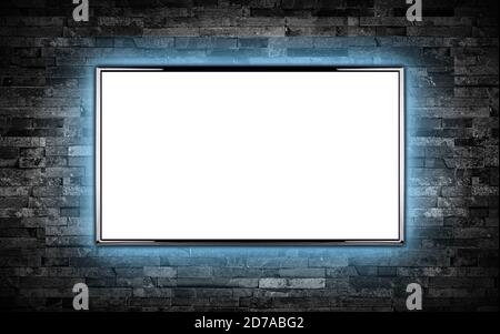 empty black flat tv screen display with copy space isolated white background. television wall mounted on dark slate stone wall glowing blue LED backgr Stock Photo