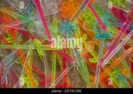 Set of small colored plastic cutlery for decorating appetizers at parties. Stock Photo