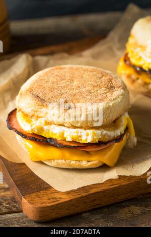 Homemade Egg English Muffin Sandwich with Bacon and Cheese Stock Photo