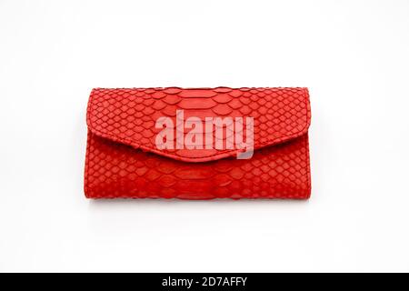 Trendy natural red snake python skin woman wallet on white isolated background. Can be used for background and wallpaper Stock Photo