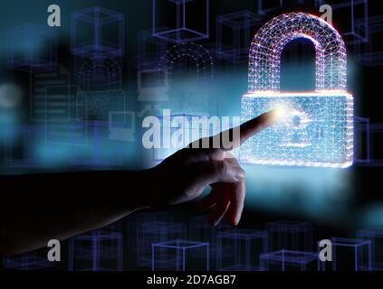 Computer security concept. Hand and padlocks symbolizing data protection in the network and personal computers. Mixed media. Stock Photo