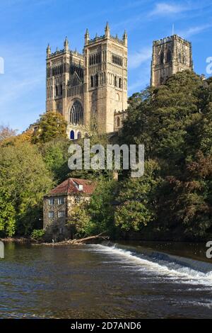 The landmark Durham Cathedral stands high above the River Wear in the city of Durham in the north east of England. Captured in autumn. Stock Photo