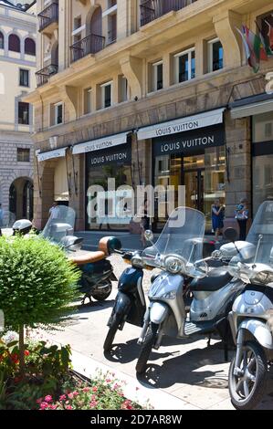 Louis Vuitton store in Padua, Italy. Scooters parked in front of the store Stock Photo