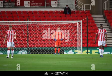 Stoke City goalkeeper Adam Davies (centre) reacts after Barnsley's Elliot Simoes (not pictured) scores his side's first goal of the game during the Sky Bet Championship match at the bet365 Stadium, Stoke. Stock Photo