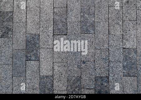 Pave stone sidewalk. Grey paved brick background. Pavement texture exterior floorSquare granite walkway, top view. Cobblestone city footpath construct Stock Photo