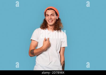 Young adult man pointing at himself, smiling wide Stock Photo
