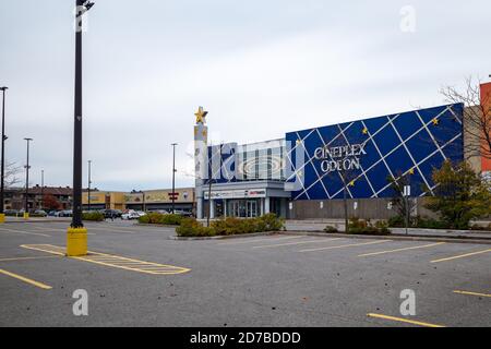 Ottawa, Ontario, Canada - October 18, 2020: A Cineplex Odeon movie theatre in Ottawa's Barrhaven community has an empty parking lot on a weekend day d Stock Photo