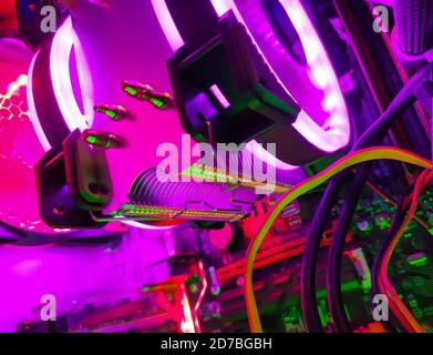 Modern computer air cooling with multi-colored led backlight-fans, cooling radiators, cables, boards, close-up, macro. Stock Photo