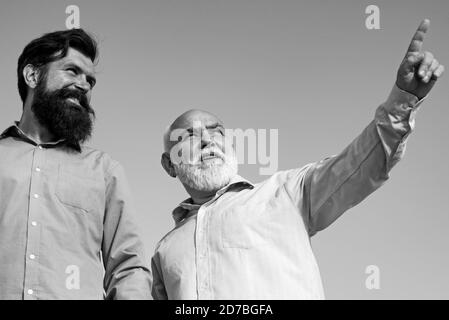 Generation of people and stages of growing up. Grandpa retiree. Portrait of two bearded men. Retirement parent. Stock Photo