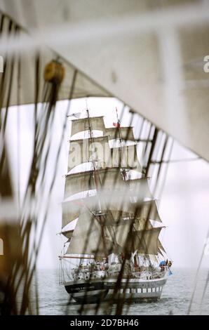 AJAXNETPHOTO. 2006. AT SEA, CHANNEL. - OCEAN YOUTH TRUST TALL SHIP STAVROS NIARCHOS UNDER SAIL IN THE ENGLISH CHANNEL SEEN THROUGH THE RIGGING OF ANOTHER TALL SHIP.PHOTO:JONATHAN EASTLAND/AJAX REF:51707 630009 Stock Photo