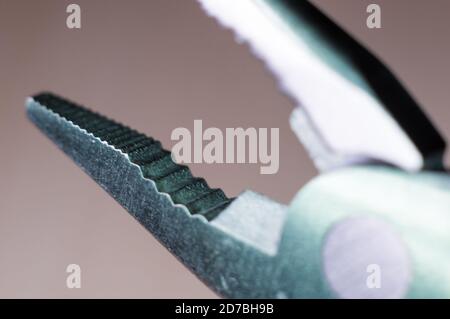 elements small foldable steel multitool, close up, macro Stock Photo