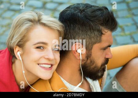 Man and woman modern clothes for youth relaxing outdoors. Couple hang out together. Youth just want have fun. Freedom feeling. Forever young. Youth Stock Photo