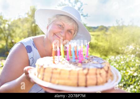 Family celebrating grandmother's birthday together. Love for mom. Happy Mothers Day Stock Photo