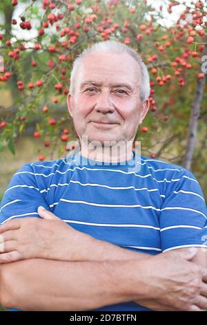 Portrait of a handsome senior man having a rest on a sunny summer day. Healthcare, resort. Happy retirement. Stock Photo