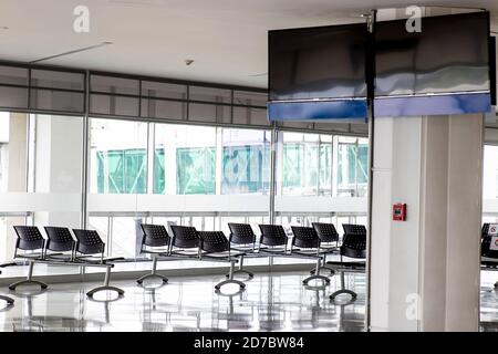 PALMIRA, COLOMBIA - OCTOBER, 2020: Empty waiting room at Cali airport in Colombia during COVID-19 pandemic with social distancing signs on chairs Stock Photo