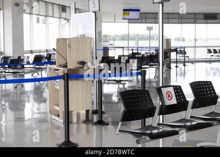 PALMIRA, COLOMBIA - OCTOBER, 2020: Empty waiting room at Cali airport in Colombia during COVID-19 pandemic with social distancing signs on chairs Stock Photo