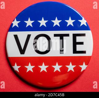 Vote buttons on red background with copy space. Election theme Stock Photo