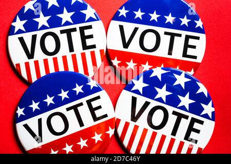 Vote buttons on red background with copy space. Election theme Stock Photo