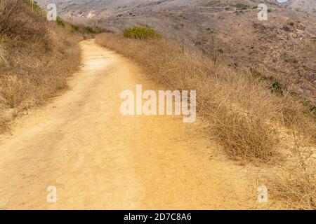 Dirt path in the hills headed somewhere Stock Photo