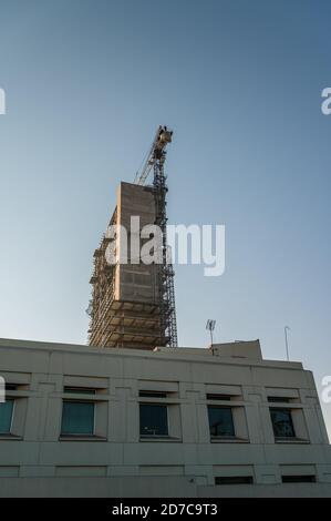 New construction high-rise with crane Stock Photo