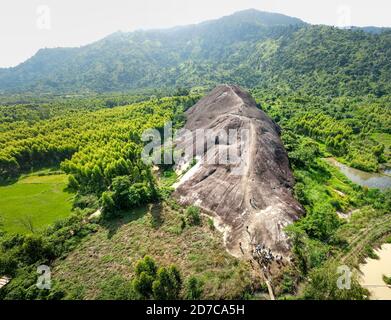 Mother Elephant Stone in Chu Yang Sin mountain range, Dak Lak province, Vietnam-September 6, 2020: Tourists visit a giant rock shaped like an elephant Stock Photo