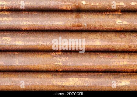 Rusty corrugated metal sheet close-up. Rusty metal texture. Multitasking creative background. Stock Photo