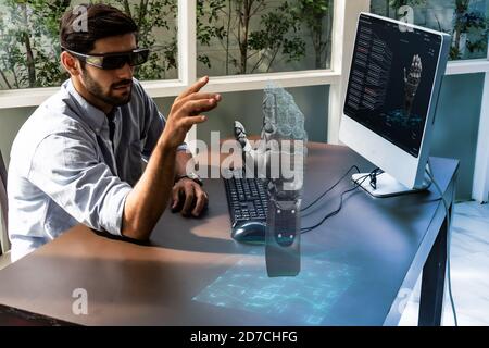 engineer in smart factory which use futuristic technology combine big data, iot, 5g, machine deep learning, automation robot, augmented mixed virtual Stock Photo