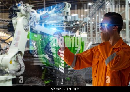 smart factory which use futuristic technology which combine big data, iot, 5g, machine deep learning, automation robot, augmented mixed virtual realit Stock Photo