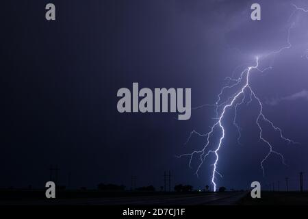 Lightning bolt storm and thunder clouds night sky near Kim, Colorado Stock Photo