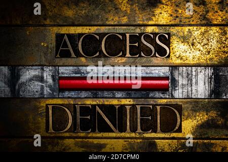 Access Denied text message with red warning sign on vintage textured grunge copper and gold background Stock Photo